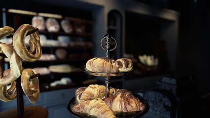 A modern cafe interior showcasing a table topped with two trays of delectable pastries.