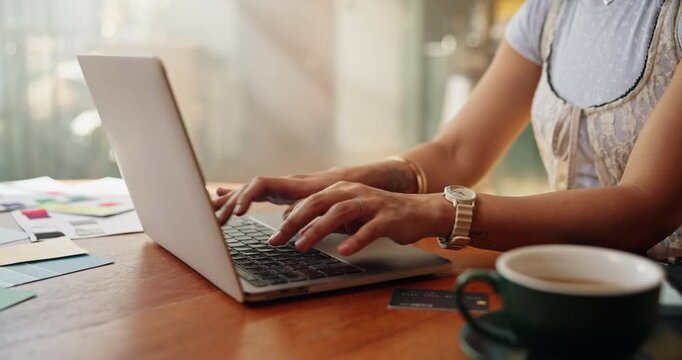 Hands, laptop and typing with designer person at table in home for remote work as entrepreneur. Computer, design and report with freelance employee in apartment for startup planning or research