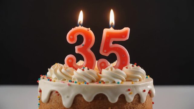 Decorated cake with candle in number 35. Video for birthday or anniversary party and celebration