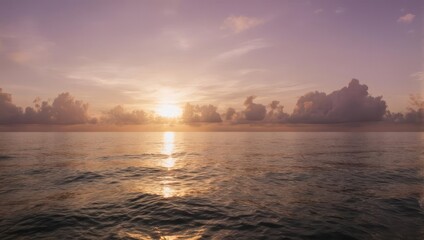 Naklejka premium Sunrise over the water with a beautiful golden glow and reflection.