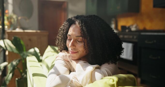 Happy, woman and thinking at window on sofa with daydreaming, self reflection or mental break. Peaceful, person and calm morning in living room with mindfulness, nostalgic memory and relax in home