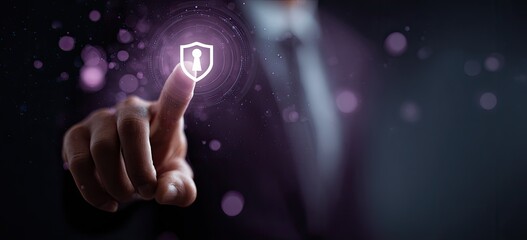 A businessperson's finger points to a glowing shield icon representing data security