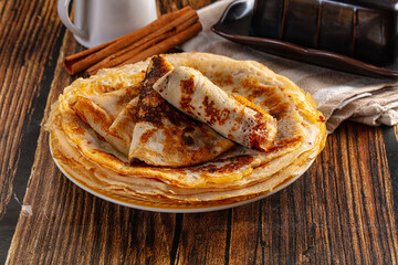 Thin homemade golden pancaces stack