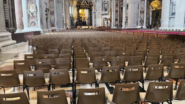 Interior of the Papal Basilica with chairs for eastern ceremony and view of St. Peter's Baldachin in background