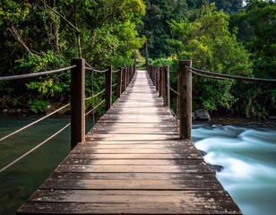 Wooden Suspension Bridge Over Flowing Stream in Lush Green Forest