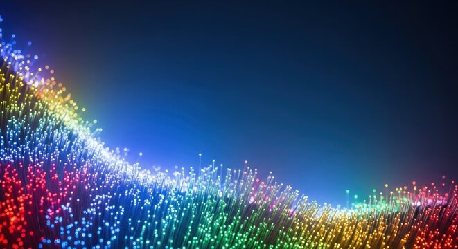 A vibrant, colorful array of fiber optic cables against a dark blue background, with a gradient of rainbow colors from red to green to blue. - Powered by Adobe
