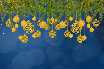 Christmas tree baubles on blue background with branches of Christmas trees and golden lights....
