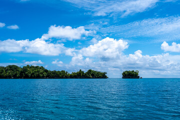 Rocky islets under blue sky, Togian Islands, Sulawesi, Indonesia