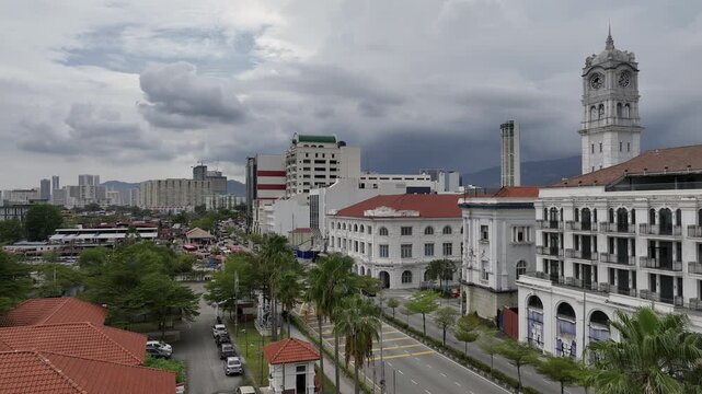 cloudy day penang island george town old stule hotel exterior traffic bay street aerial panorama 4k malaysia