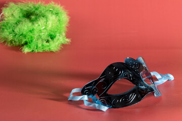 Venetian carnival mask, forming frame in one of the lower corners with space for text