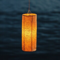 Tranquil Evening Scene with Illuminated Paper Lantern Against a Calm Dark Background