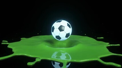 A soccer ball bounces on a splash of green liquid against a black background