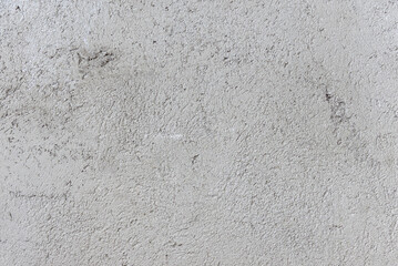 Rough raw concrete surface texture with natural imperfections. Ideal for industrial backgrounds, 3D rendering and graphic design.