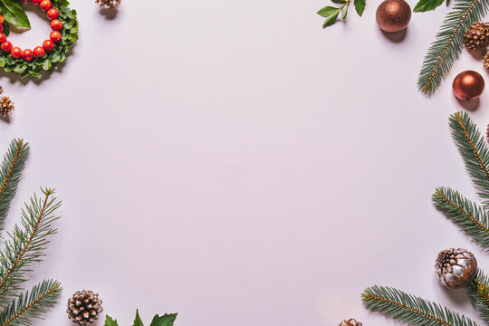 Festive christmas wreath and ornaments border on white background - Powered by Adobe
