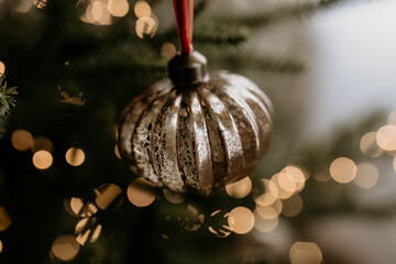 Vintage Silver Christmas Ornament with Warm Bokeh Lights