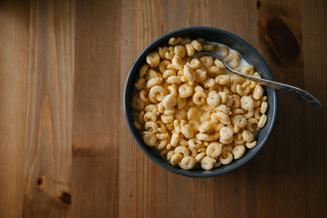 Bowl of Crunchy Breakfast Cereal with Spoon