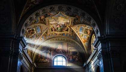 Sunlight Rays Through Church Vaulted Ceiling