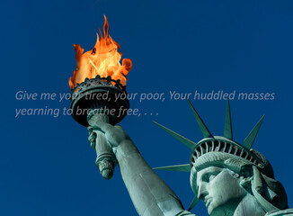 Statue of Liberty with real flames and famous saying about being free