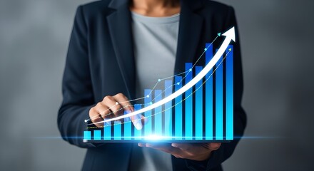 Business Woman holding Tablet with Glowing Blue Bar Chart and Growth Arrow Concept