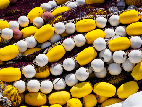 Close-up of fishing nets with yellow and white buoys