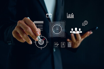 business professional using digital interfaces to manage time, goals, and productivity, highlighting modern technology, planning efficiency, and data-driven management in a smart corporate workflow.