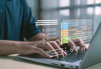 digital project planning concept showing interactive Gantt charts and task tracking on laptop, illustrating workflow management, productivity, modern business scheduling in a professional environment.
