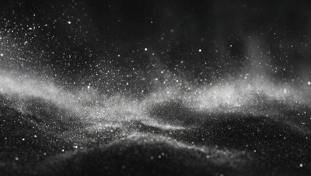 Abstract monochrome image of granular dust rising with hints of distant stars