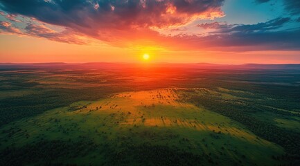 Aerial sunset over grassy plains