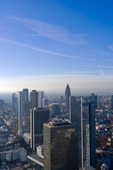 Obraz premium Aerial view of skyscrapers at financial district of German city of Frankfurt seen from Main Tower rooftop on a sunny autumn day. Photo taken November 22nd, 2025, Frankfurt am Main, Germany.