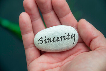 Stone showing Sincerity Text text engraved on it.