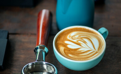 Barista Training Setup with Complete Latte Art Tools and Espresso Preparation Elements on Wooden Surface Coffee Tools Flat Lay: Organized Portafilter, Milk Jug, and Cups for Specialty Coffee.