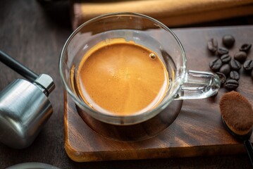 Portafilters and Espresso Shot Arranged on Wooden Table, Focus on Coffee Making Tools and Crema Texture in Rustic Style Premium Espresso: Hot Coffee with Perfect Crema in Glass Cup