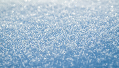 Obraz premium Macro close-up of a sparkling blanket of pristine snow, showcasing countless delicate ice crystals shimmering under natural light, creating a beautiful winter texture and abstract background