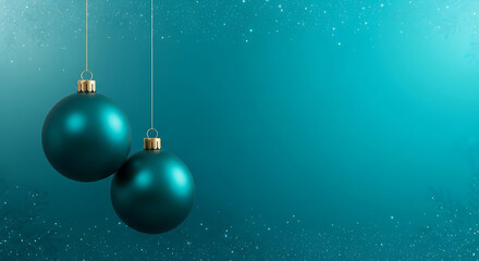Two teal christmas ornaments hanging against a textured teal background