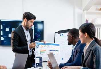 team of multiethnic colleague discuss budget performance planning, sharing idea for cost reduction, business people man woman diverse employee coworker in formal suit meeting in finance office