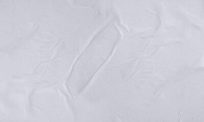 Folded white paper texture backdrop, crumpled poster surface, empty background for text or graphics