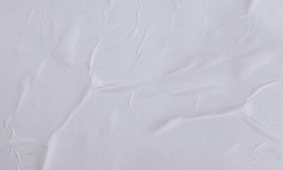 Obraz premium Folded white paper texture backdrop, crumpled poster surface, empty background for text or graphics