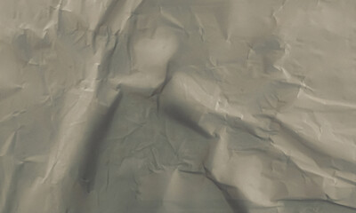 Folded white paper texture backdrop, crumpled poster surface, empty background for text or graphics