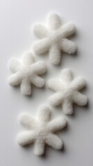 Creative winter concept: sugar snowflakes on white background for decoration and design