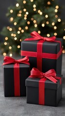 Elegant black gift boxes with red ribbons perfect for christmas celebration and holiday decor