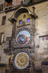 Astronomical clock illuminated at night on the Old Town Hall in Prague, Czechia