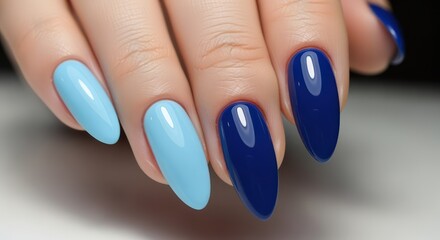Elegant oval nail design in two-tone blue palette for sophisticated fashion statements and modern beauty trends, a stylish manicure closeup