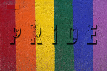 PRIDE concept. Background with embossed lettering on a wall with texture and colors of the rainbow flag.