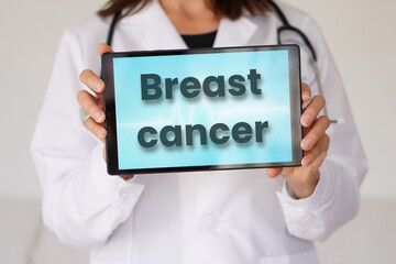 breast cancer. medical concepts. female doctor displaying words on a digital tablet
