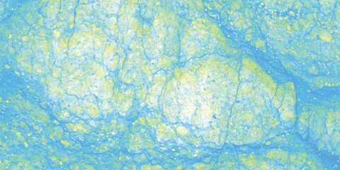 Textured abstract background in shades of blue and yellow, with a speckled appearance and subtle cracked surface, suggesting a natural stone or weathered material for artistic backgrounds