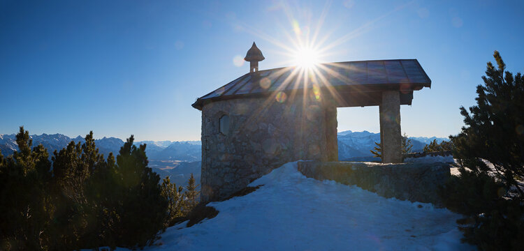 pilgrimage chapel at Fahrenbergkopf mountain, at sunset. hiking destination in winter - Powered by Adobe