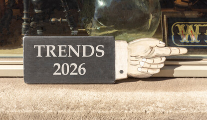 Trends 2026 new year symbol. Concept words Trends 2026 on beautiful black wooden hand sign....