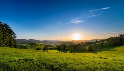 a lush green expanse extends to the skyline sprinkled with trees and soft rolling hills beneath a clear azure sky embodying peacefulness and nature s charm at dawn