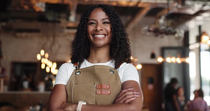 Face, barista and woman in cafe with confidence, smile and about us with career pride in startup. Portrait, waitress and happy person in coffee shop, hospitality or arms crossed in small business