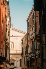 View between the houses of Venice onto a church 